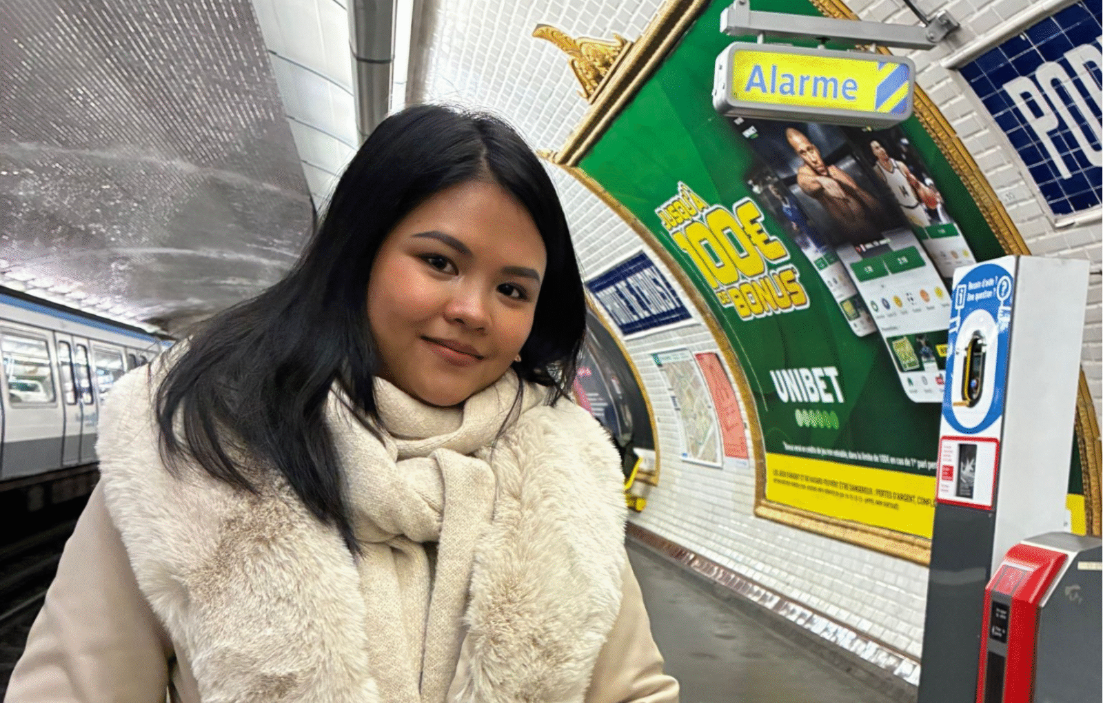 Nicole Ulanday, the author of the article standing in a Paris subway station.
